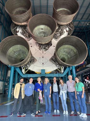 The Cerebral Ageing team in front of the historical Saturn V rocket on display at KSC.